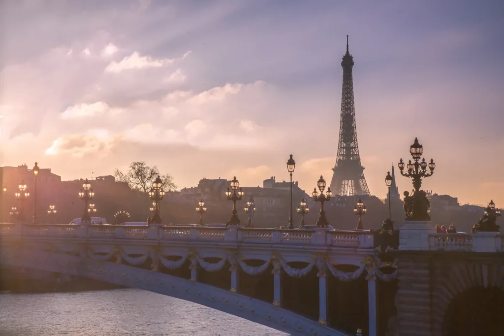 Ornate lamps on Pont Alexandre III with the Eiffel Tower behind, Paris